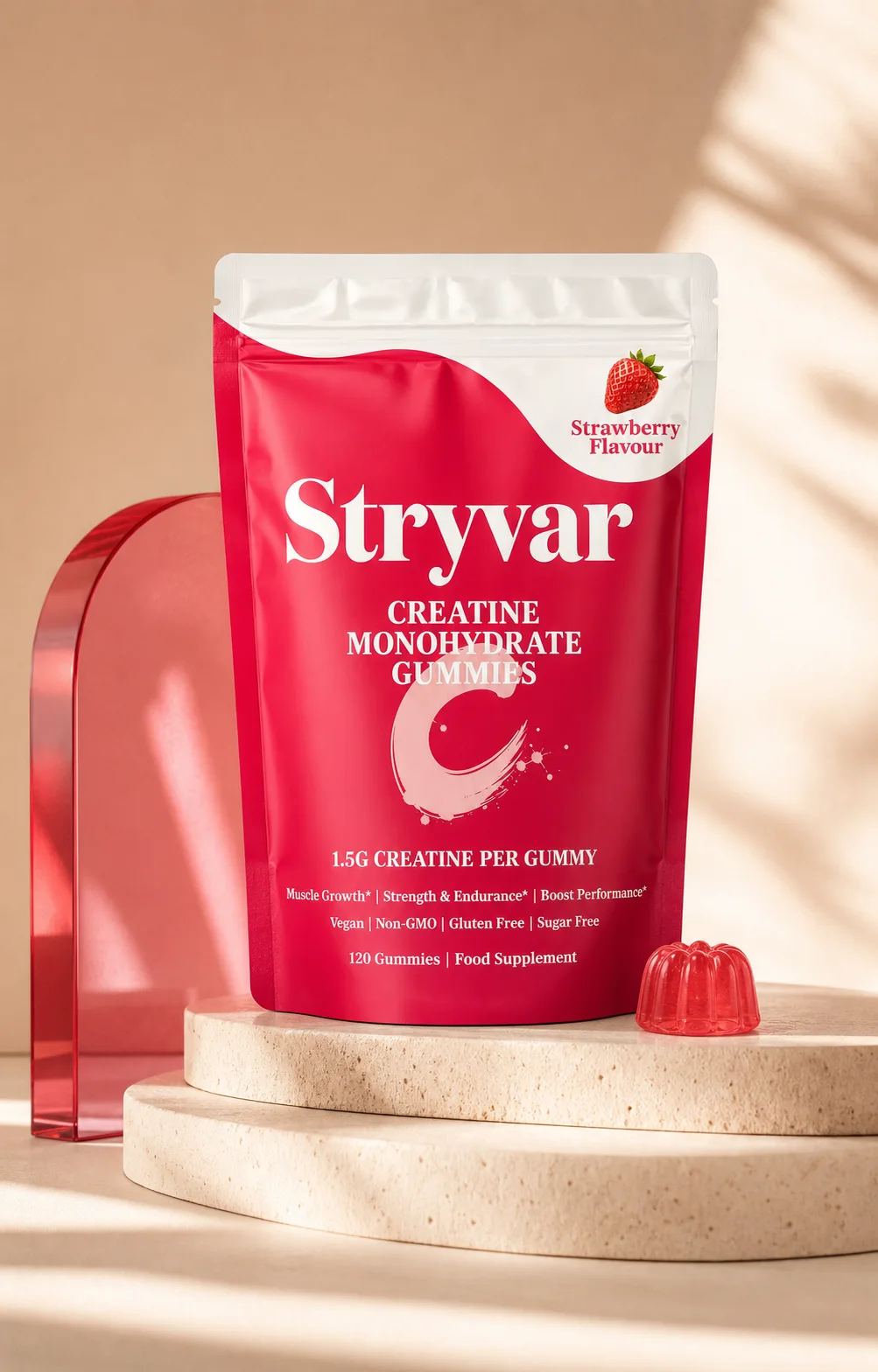Stryvar Strawberry creatine gummies pouch on a pink pedestal