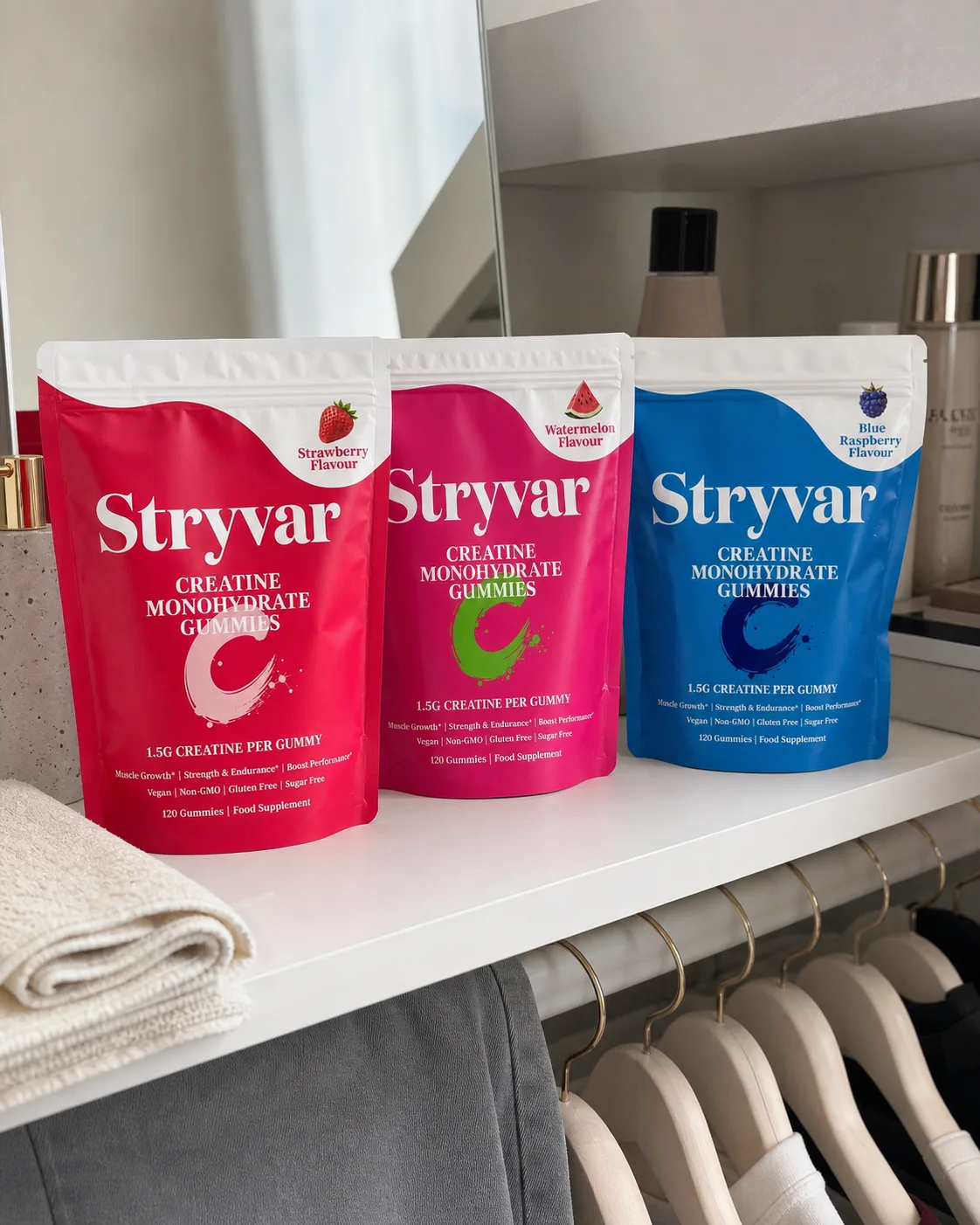 All three Stryvar pouches arranged on an everyday wardrobe shelf